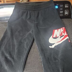 Nike Kids Black Sweatpants with Red Logo